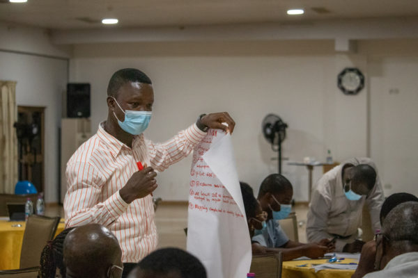 Ghana action planning participants prioritize activities on flipchart paper. Photo credit: Andie Tucker